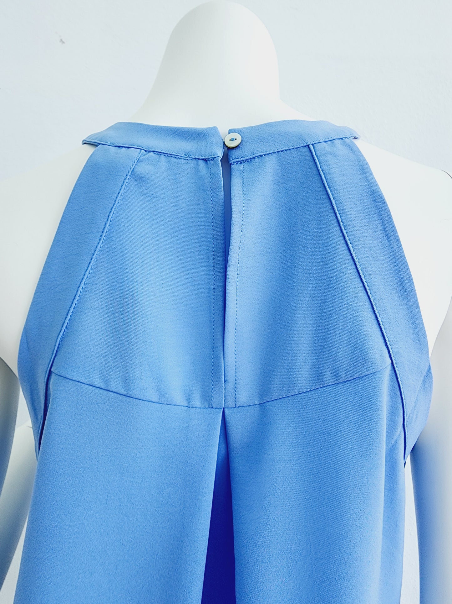 Light blue top with cream