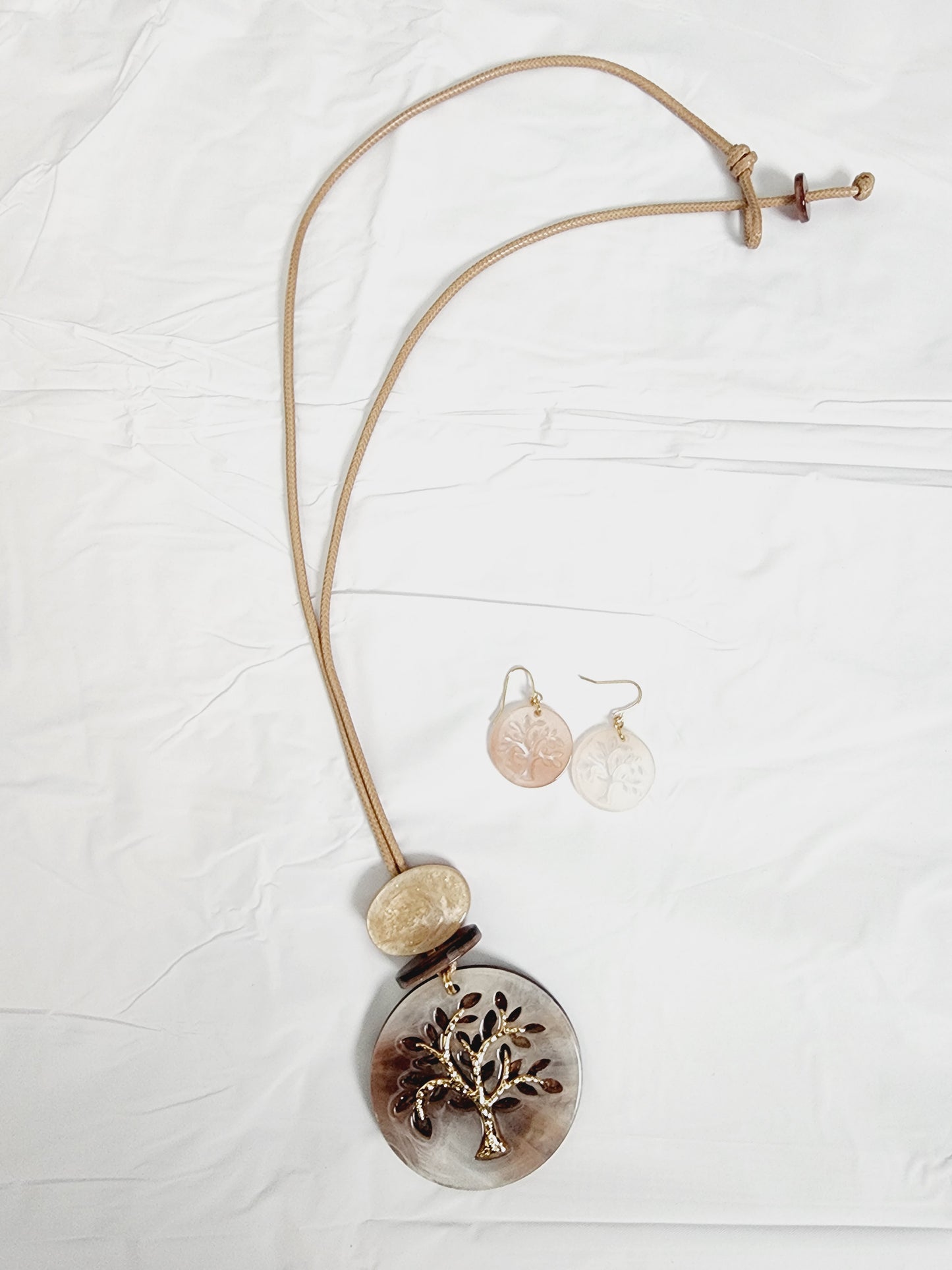 Set of earrings and long necklace with tree of life
