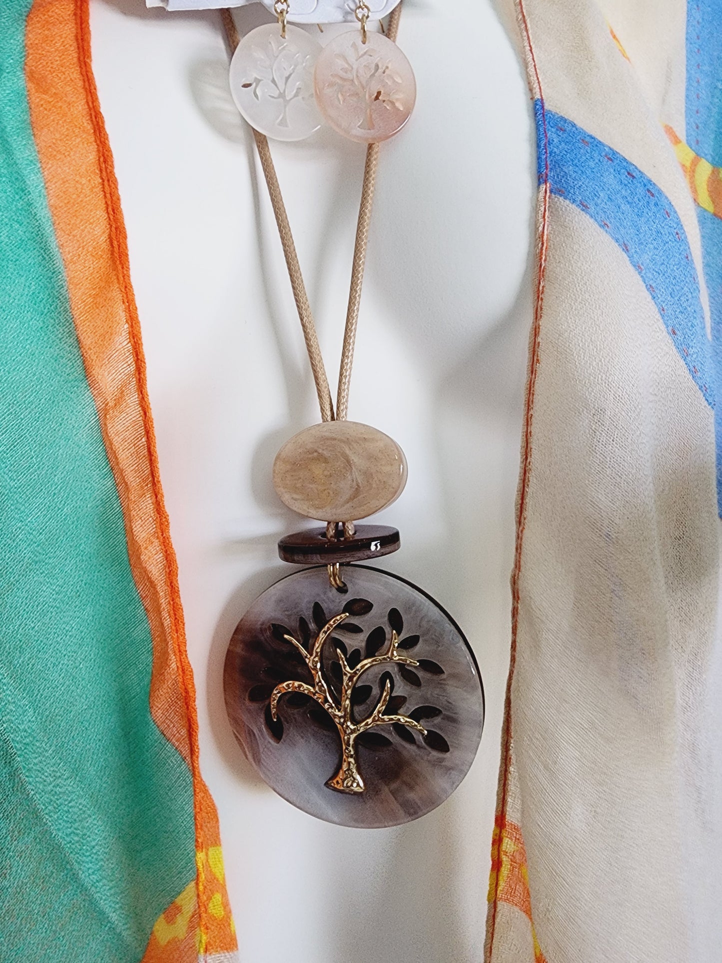 Set of earrings and long necklace with tree of life