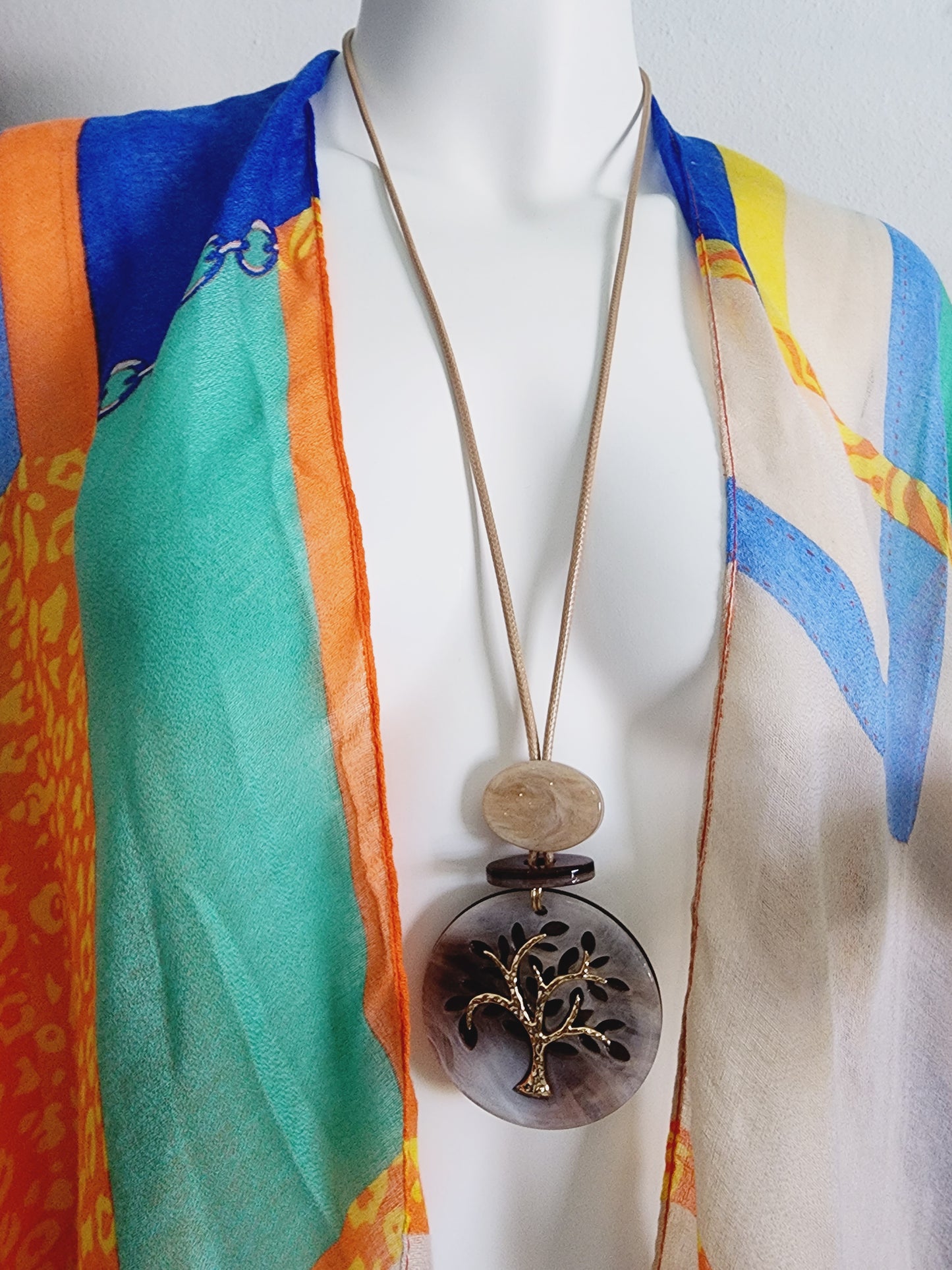 Set of earrings and long necklace with tree of life