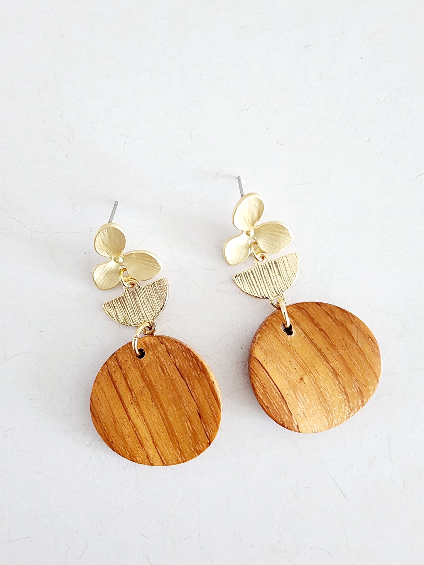 Wooden earring with golden flower