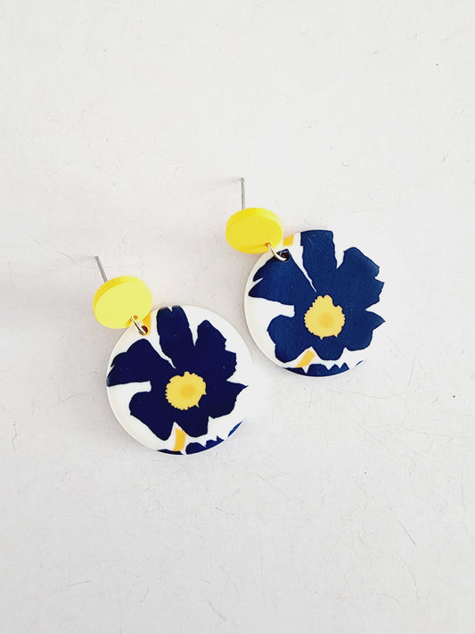 Trendy polymer earrings with blue flower