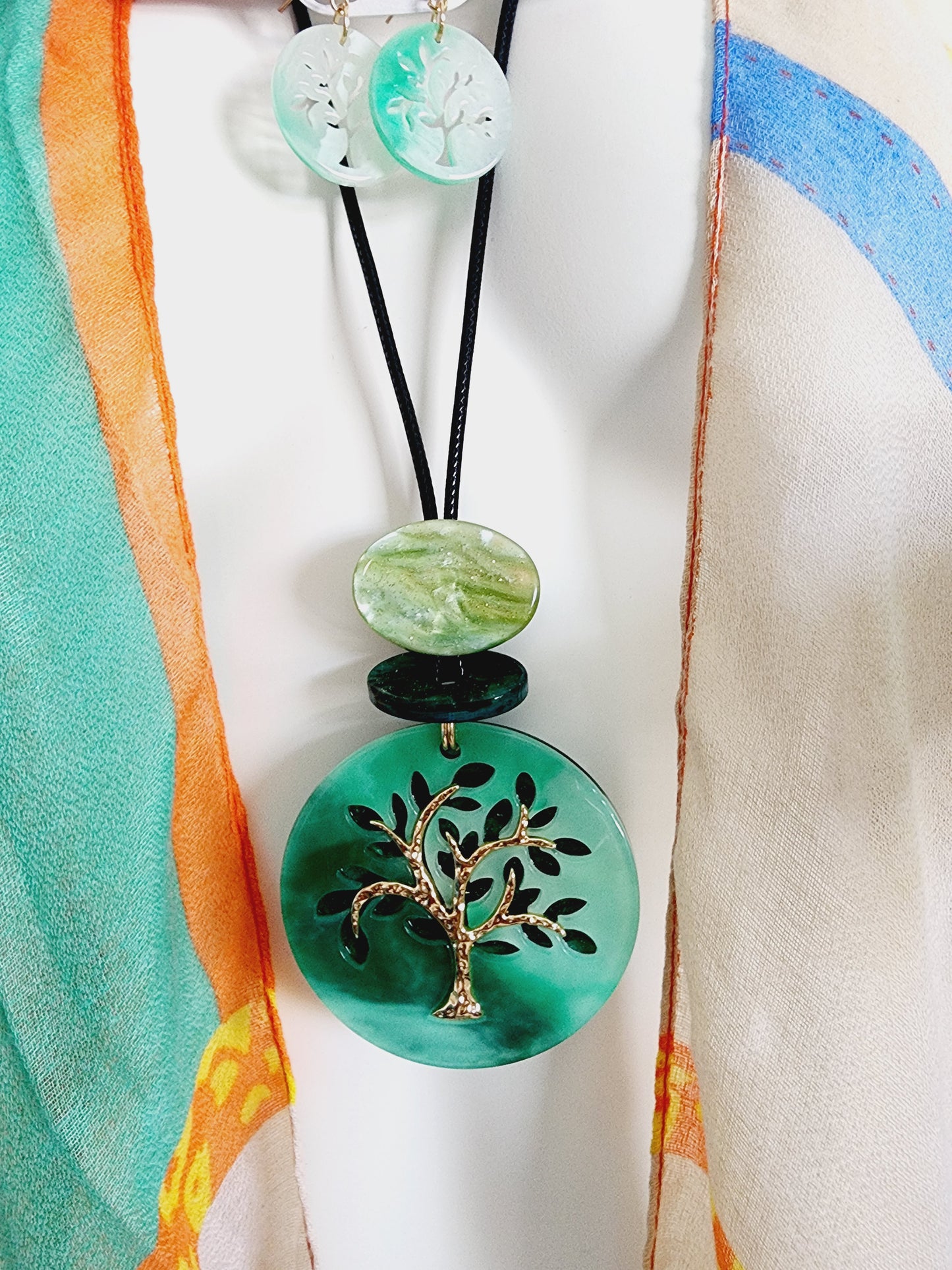 Set of earrings and long necklace with tree of life
